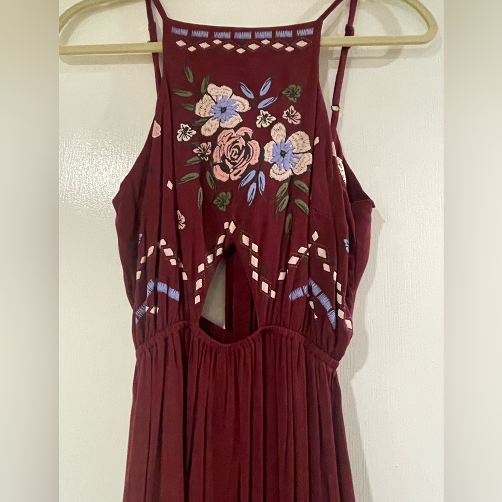 BRAND NEW WITH TAGS! Francesca’s Maroon Maxi Dress with cutouts.